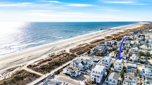 bird's eye view with a view of the beach and a water view