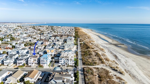 drone / aerial view with a view of the beach and a water view