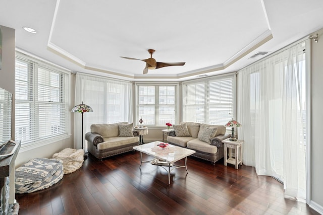 sunroom / solarium with a tray ceiling and ceiling fan