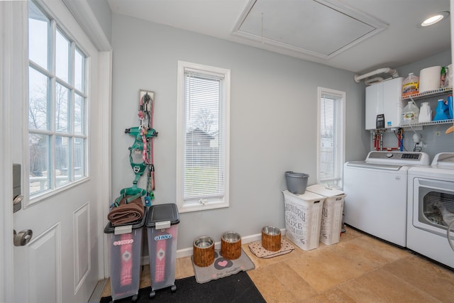 laundry area featuring recessed lighting, cabinet space, attic access, separate washer and dryer, and baseboards