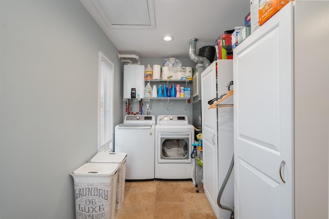 laundry area with laundry area, washer and clothes dryer, tankless water heater, and recessed lighting