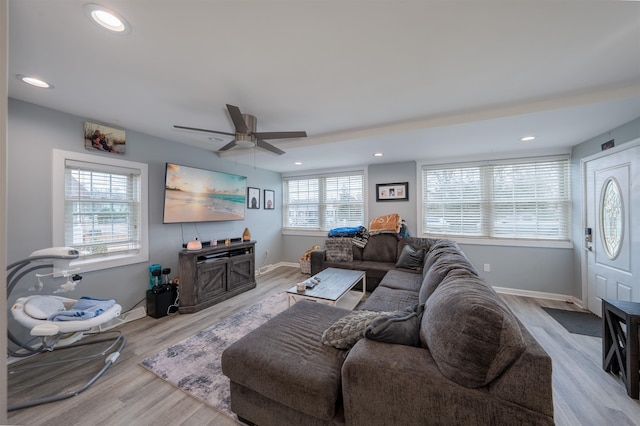 living area featuring recessed lighting, a fireplace, wood finished floors, a ceiling fan, and baseboards