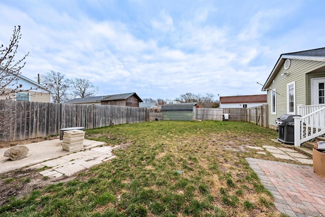 view of yard with a patio and a fenced backyard