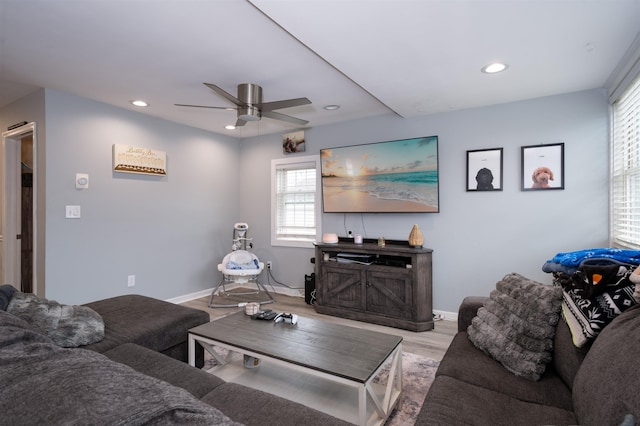 living room featuring baseboards, a ceiling fan, wood finished floors, and recessed lighting