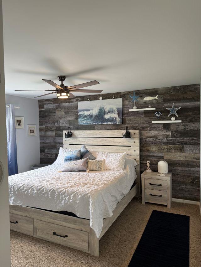5301 Hudson Ave Unit B, Wildwood, NJ 08260 - bedroom with wood walls, carpet flooring, and ceiling fan