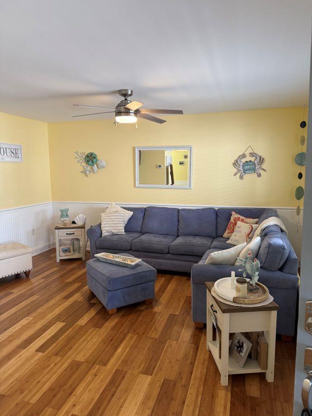 5301 Hudson Ave Unit B, Wildwood, NJ 08260 - living room featuring a wainscoted wall, wood finished floors, and ceiling fan