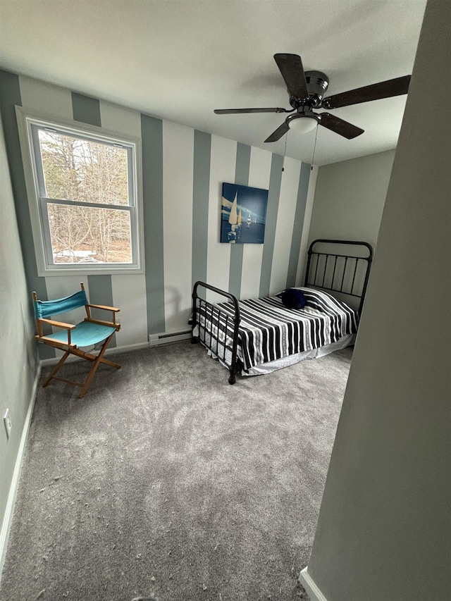 carpeted bedroom with a baseboard radiator, baseboards, and a ceiling fan