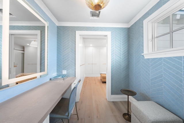 bathroom with hardwood / wood-style flooring and ornamental molding