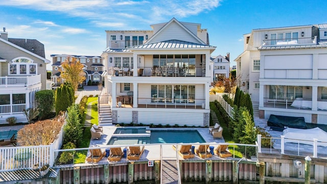 back of house with a balcony