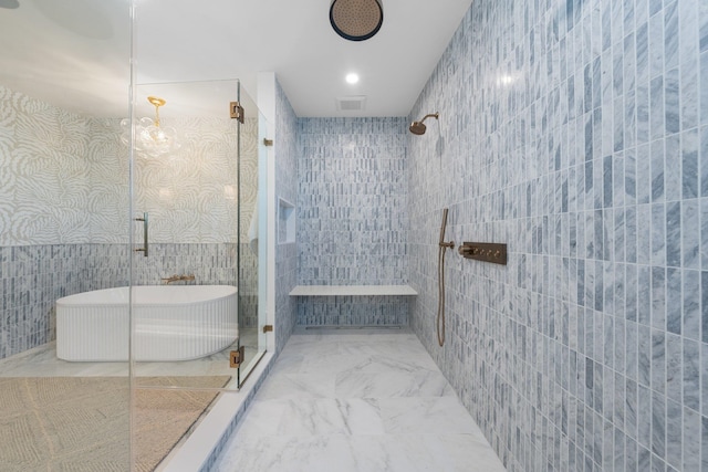 bathroom featuring tile walls and independent shower and bath