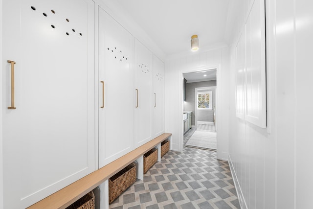 mudroom featuring ornamental molding