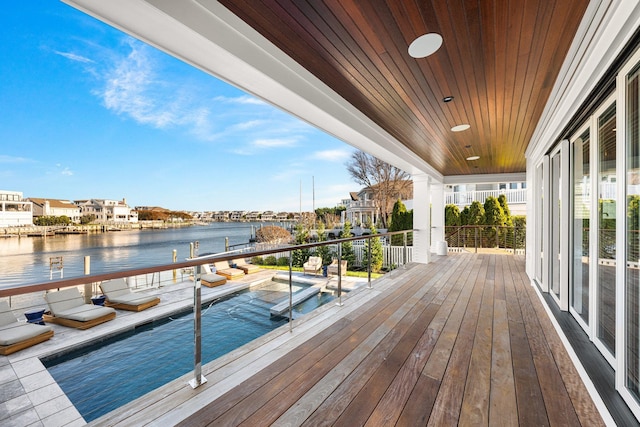 wooden deck with a water view