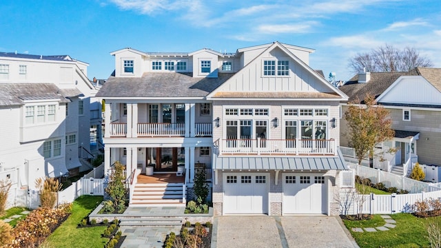 view of front facade with a porch, a garage, and a balcony