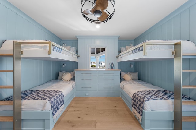 bedroom with light hardwood / wood-style floors and ceiling fan