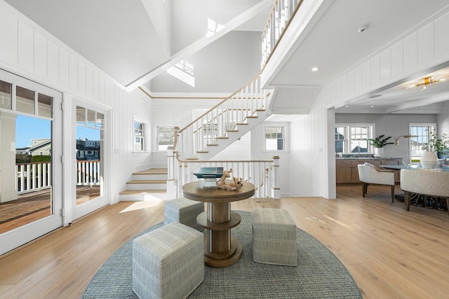 interior space with crown molding and light wood-type flooring