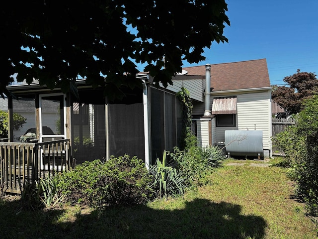 view of property exterior with a yard