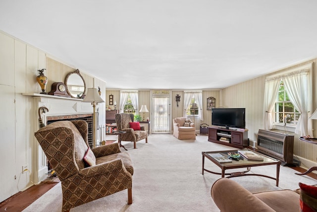 2320 Shore Rd, Ocean View, NJ 08210 - living room featuring healthy amount of natural light, a brick fireplace, and a wall mounted air conditioner