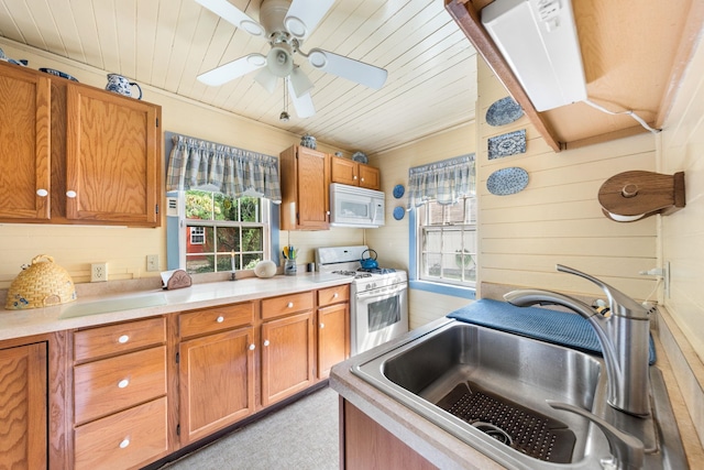 2320 Shore Rd, Ocean View, NJ 08210 - kitchen featuring white appliances, a sink, healthy amount of natural light, wooden ceiling, and light countertops