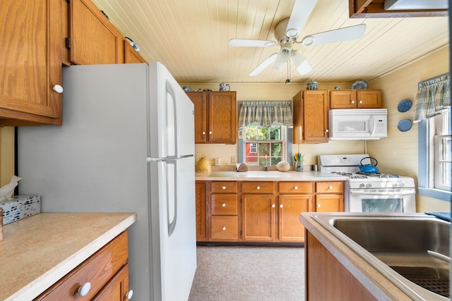 2320 Shore Rd, Ocean View, NJ 08210 - kitchen featuring white appliances, brown cabinetry, wooden ceiling, a ceiling fan, and light countertops