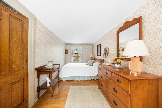 2320 Shore Rd, Ocean View, NJ 08210 - bedroom with wallpapered walls and light wood-style floors