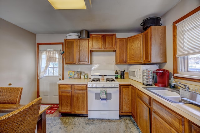 kitchen with sink and white appliances