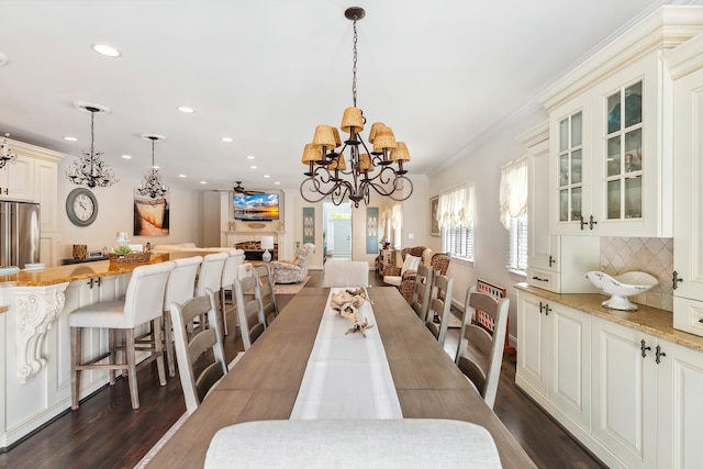 148 W Heather Rd Unit 148, Wildwood Crest, NJ 08260 - dining room with a chandelier, recessed lighting, dark wood-style floors, and ornamental molding