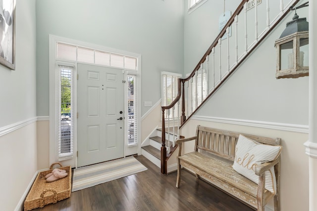 148 W Heather Rd Unit 148, Wildwood Crest, NJ 08260 - foyer with a high ceiling, stairs, dark wood finished floors, and baseboards