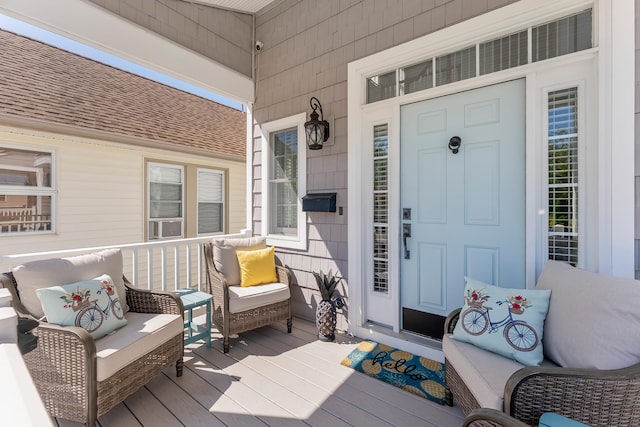 148 W Heather Rd Unit 148, Wildwood Crest, NJ 08260 - view of exterior entry featuring covered porch and roof with shingles