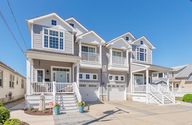 148 W Heather Rd Unit 148, Wildwood Crest, NJ 08260 - view of front of house with covered porch, an attached garage, concrete driveway, and stairs