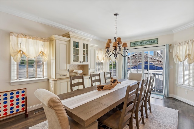 148 W Heather Rd Unit 148, Wildwood Crest, NJ 08260 - dining area featuring a chandelier, ornamental molding, baseboards, and dark wood-type flooring