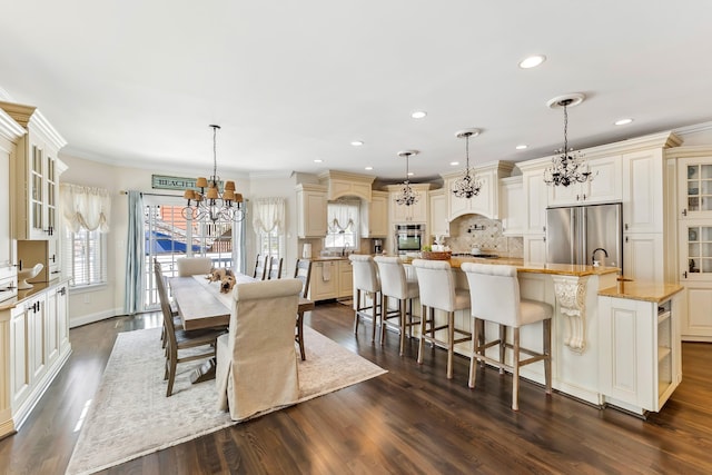148 W Heather Rd Unit 148, Wildwood Crest, NJ 08260 - dining space featuring a chandelier, dark wood-style floors, recessed lighting, and crown molding
