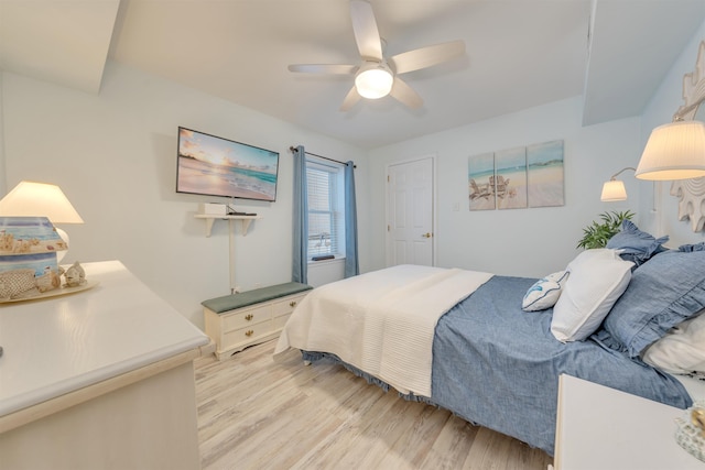 bedroom with light wood finished floors and ceiling fan