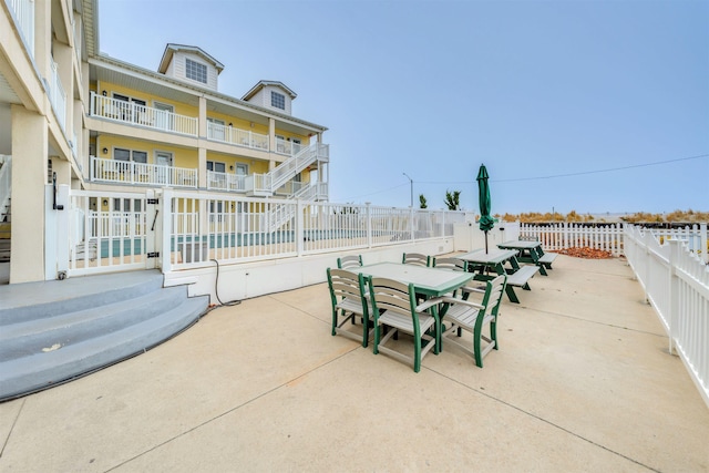 view of patio / terrace featuring fence and outdoor dining area