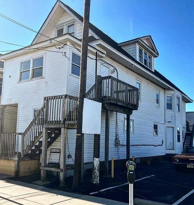 view of property exterior featuring a balcony