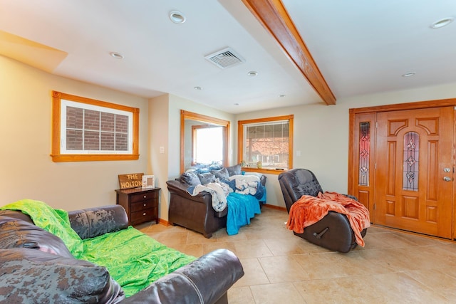 living room with beam ceiling