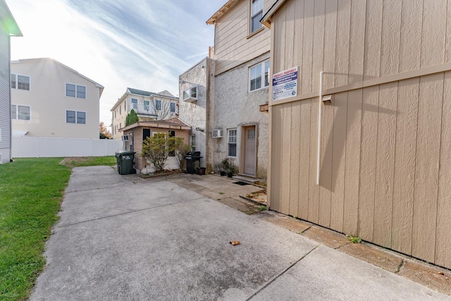 view of property exterior with a patio