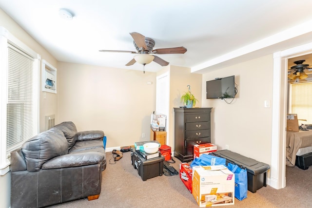 living room with carpet flooring and ceiling fan