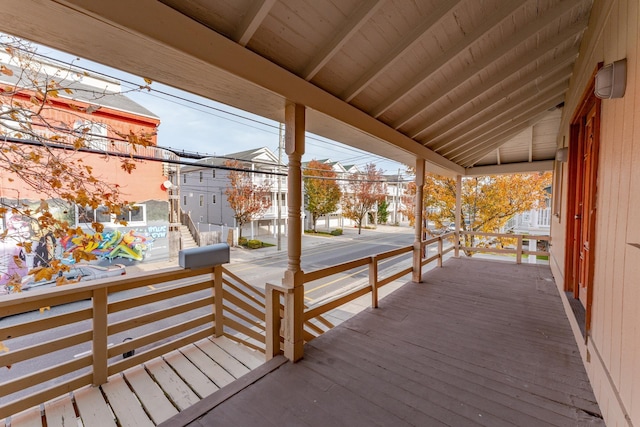 wooden terrace featuring covered porch