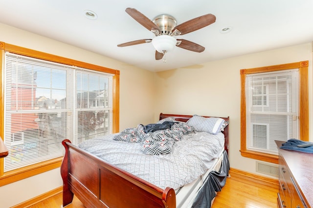 bedroom featuring ceiling fan and light hardwood / wood-style flooring