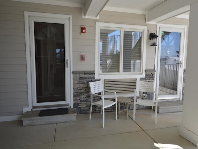 177 80th St Unit 104, Avalon, NJ 08202 - property entrance with stone siding