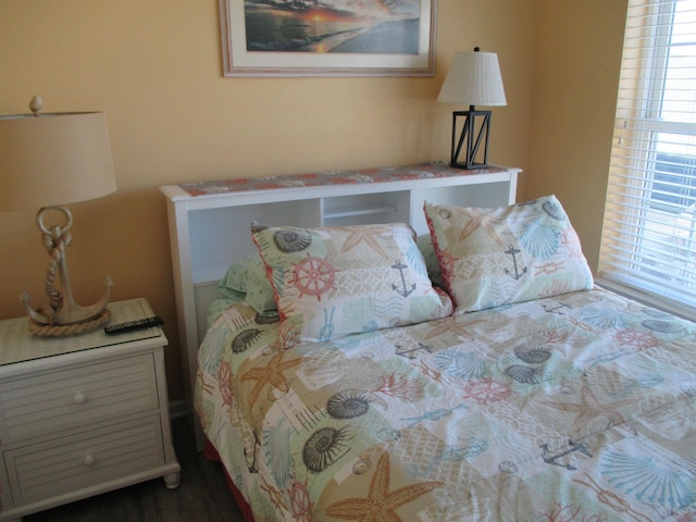 bedroom with multiple windows