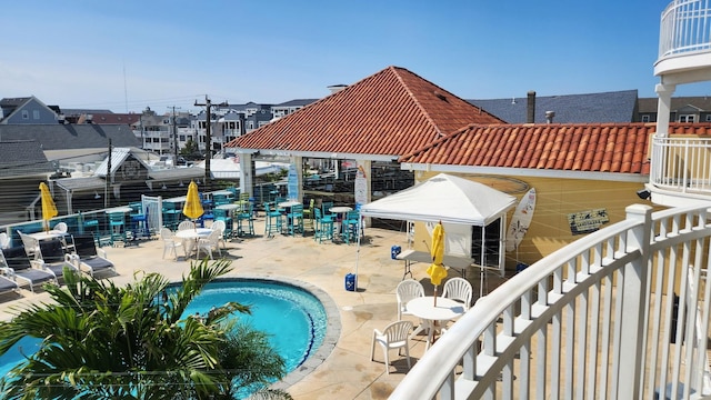 community pool with a patio area