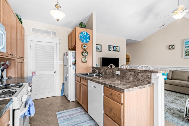 216 E Roberts Ave Unit 7, Wildwood, NJ 08260 - kitchen with white appliances, a peninsula, lofted ceiling, dark countertops, and open floor plan