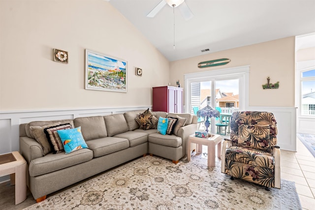 216 E Roberts Ave Unit 7, Wildwood, NJ 08260 - tiled living room with a wainscoted wall, vaulted ceiling, ceiling fan, and a decorative wall