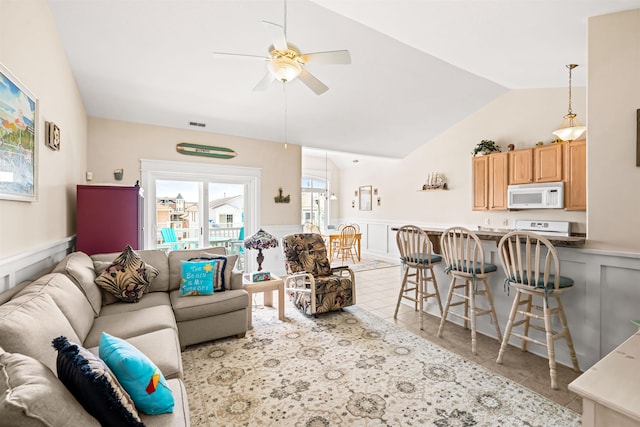 216 E Roberts Ave Unit 7, Wildwood, NJ 08260 - tiled living area with a wainscoted wall, a ceiling fan, a decorative wall, and lofted ceiling