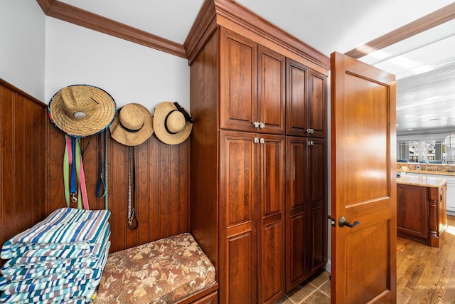 interior space featuring crown molding and wood finished floors