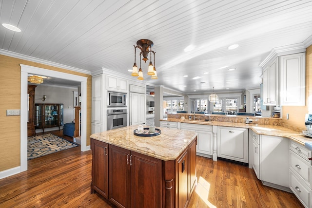 kitchen featuring crown molding, white cabinets, dark wood-style flooring, and appliances with stainless steel finishes