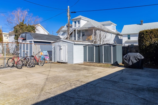 view of property exterior with a storage unit