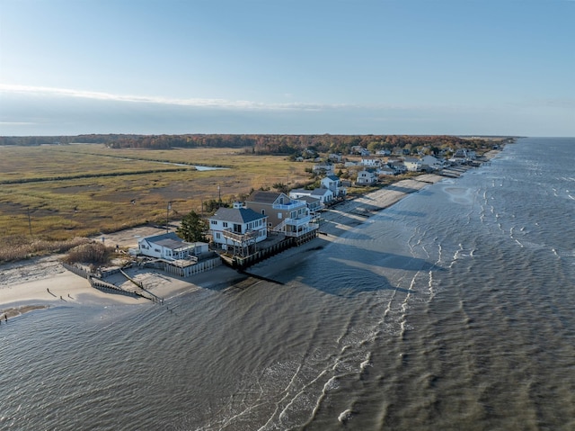 bird's eye view featuring a water view and a view of the beach