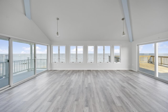 unfurnished sunroom with vaulted ceiling with beams, a water view, and a chandelier